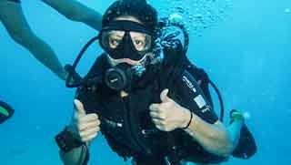 Discover Scuba Diving diver smile and show tumbs up to the camera