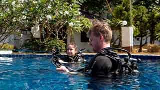 PADI Reactivate Scuba Refresher Program divers on the surface in the swimming pool at Crystal Dive Koh Tao.
