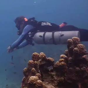 Sidemount specialty diver course diver swim behind coral