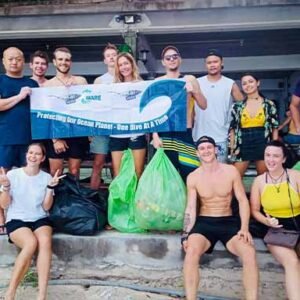 Project Aware Specialty Diver course people after collecting trash with padoi aware flag on land